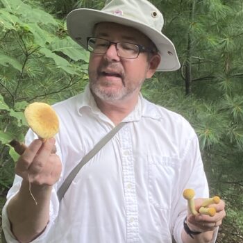 Jonathan holds mushrooms for program participants to enjoy.