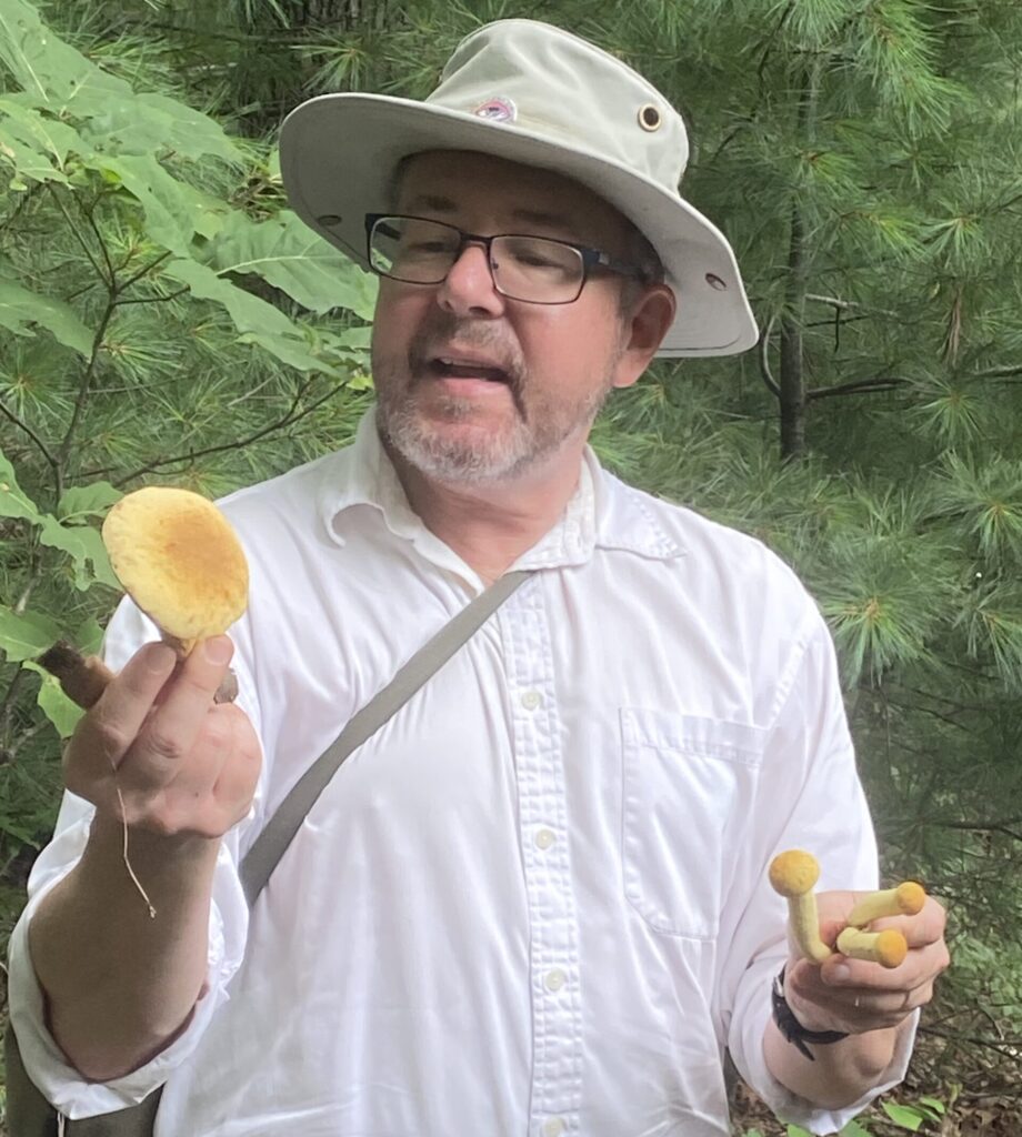 Jonathan holds mushrooms for program participants to enjoy.